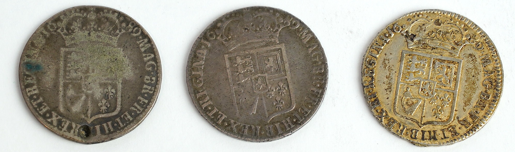 British silver coins, William and Mary (1689-94), three halfcrowns, all 1689, first reverse (S3434), the first fine, the second demounted and later gilded otherwise fine and the third holed, otherwise VG (3)
